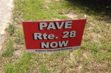 Chatham Businesses Want Rte. 28 Paved So Bad They Even Made Signs